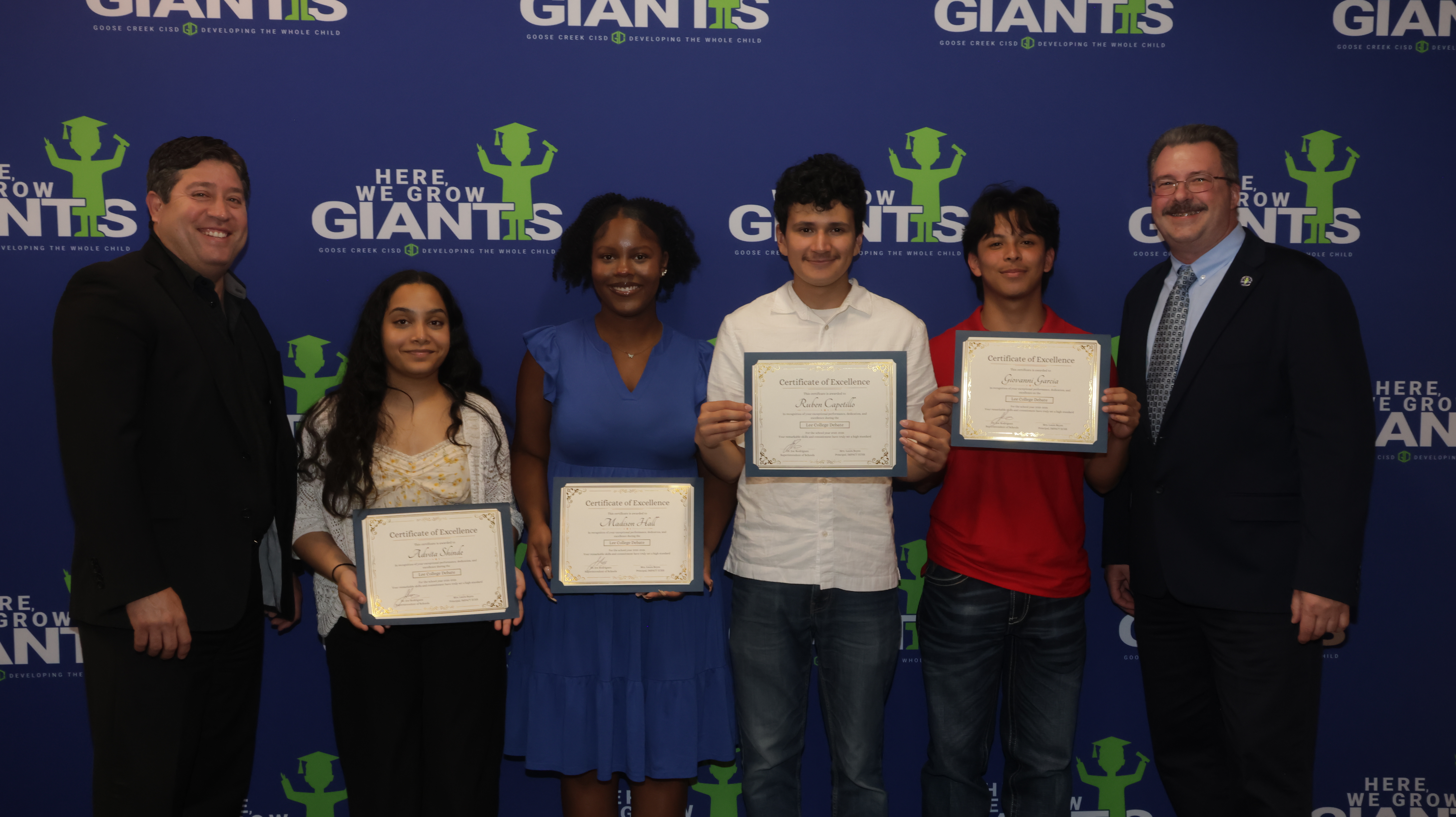 lee college debate students pose with district leadership while holding their certificates