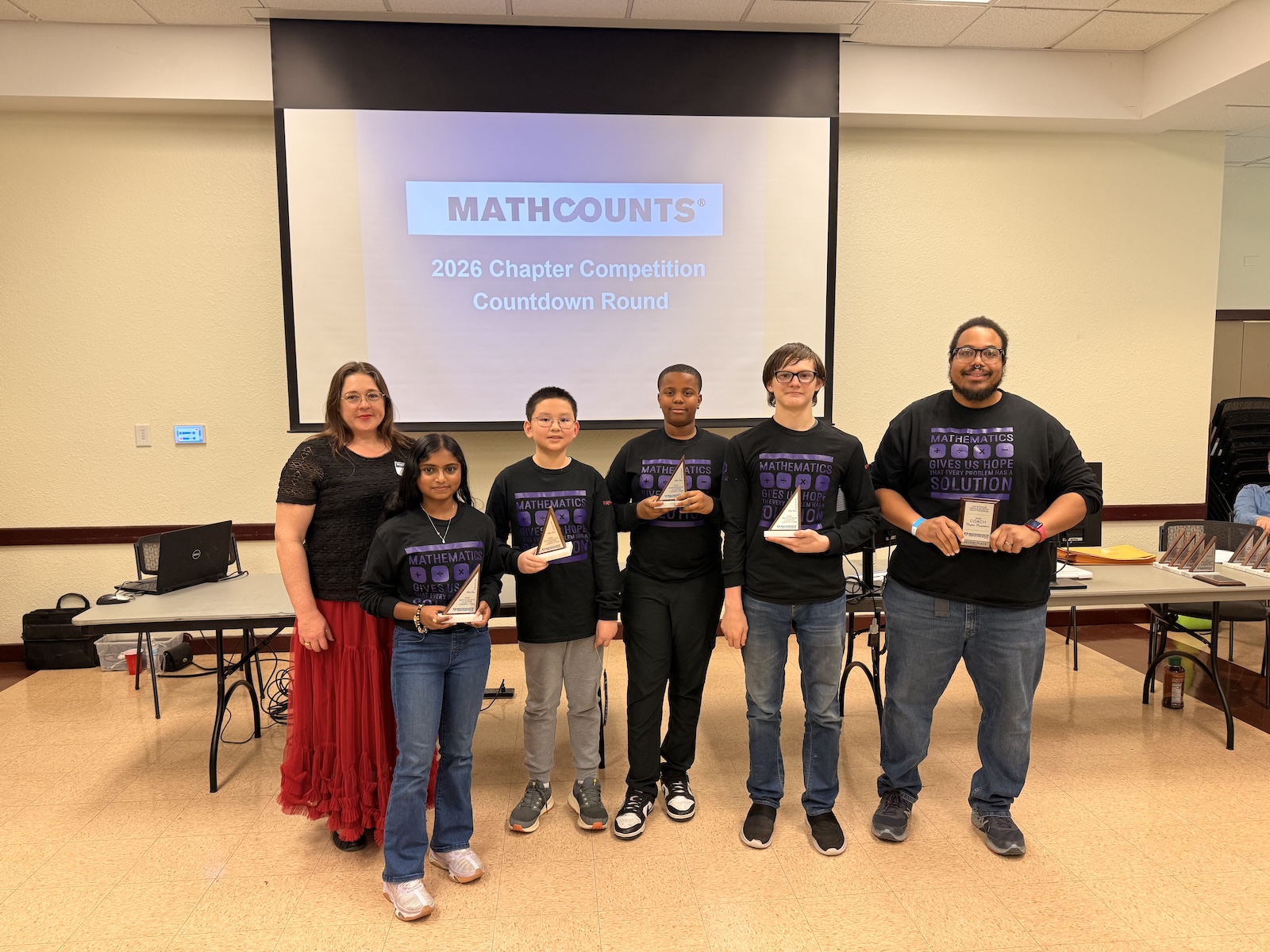 EF Green students pose with awards and coaches