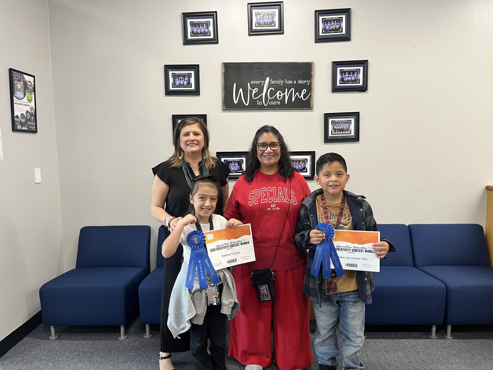 highlands elementary principal and students pose with award in school