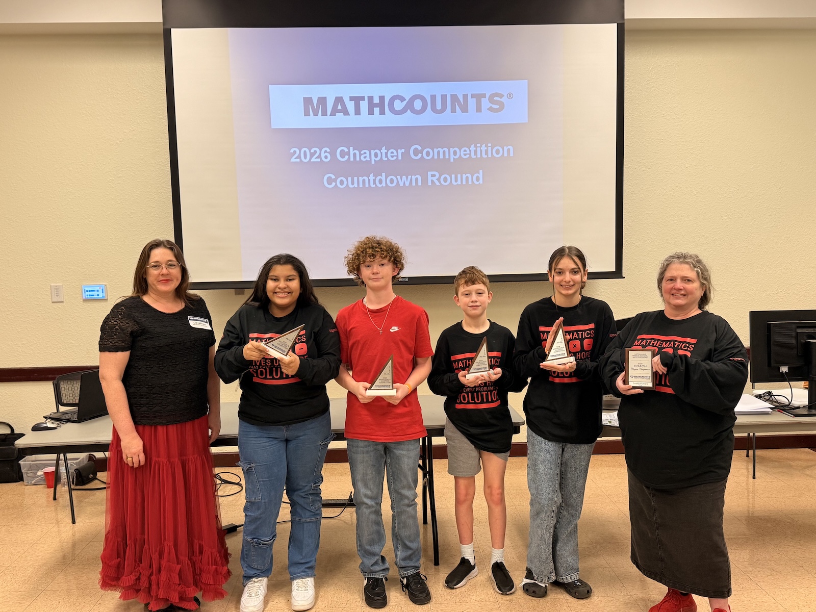 Baytown Junior students pose with awards and coaches
