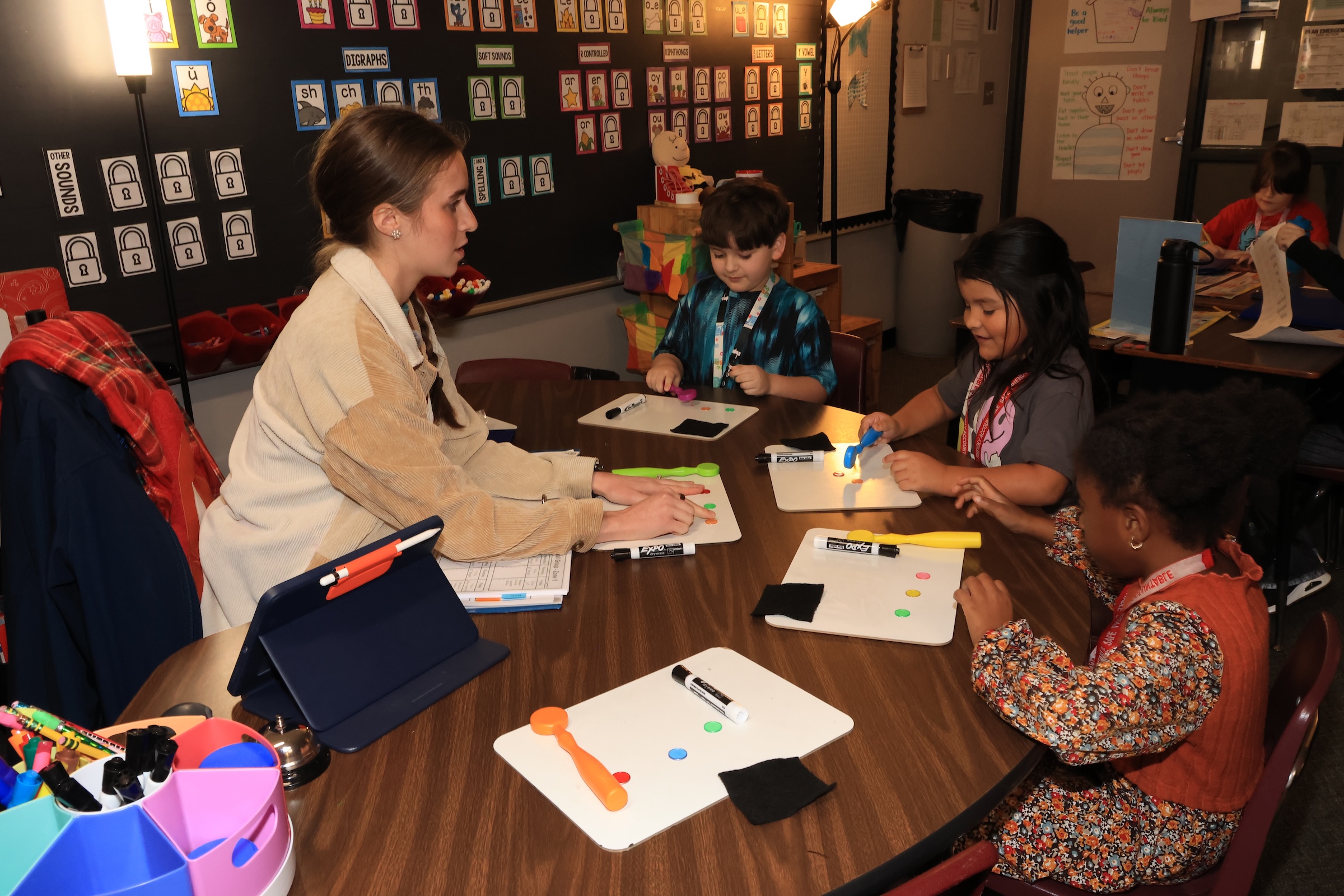 teacher working with small group of students