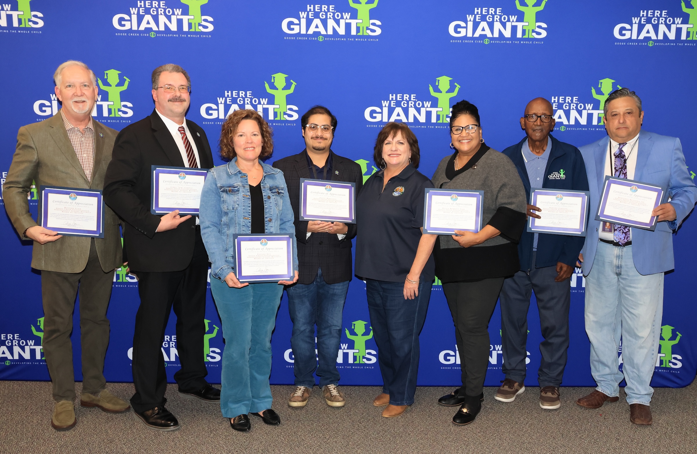 School board members pose with their recognition certificates