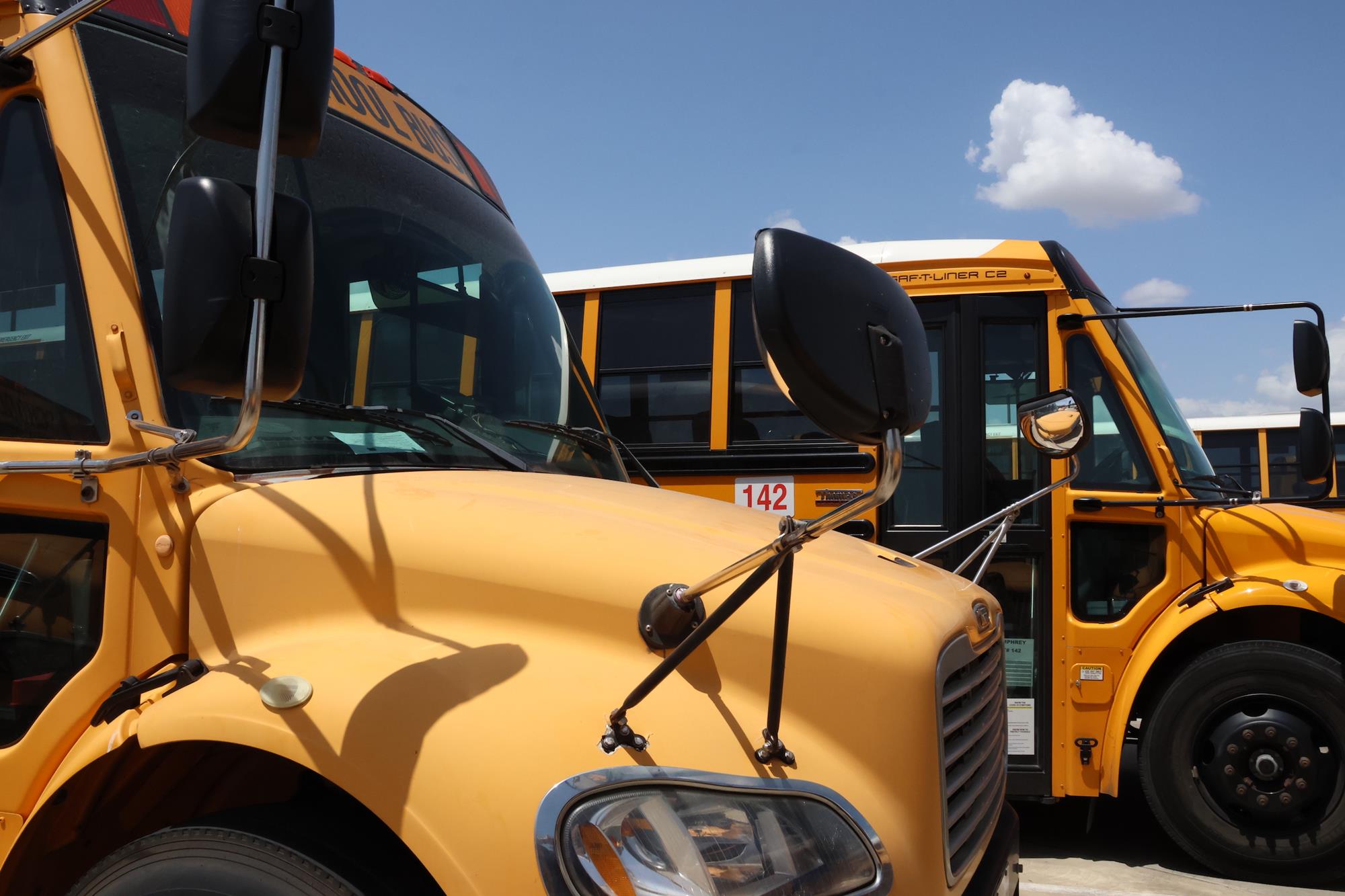 two school buses side by side